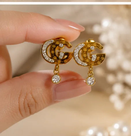Gilded Crystal Emblem Drop Earrings